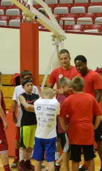 Kevin Yogi Ferrell talks to his team at a recent camp