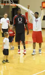 Robert Johnson celebrates his team's victory in a summer camp championship game over Hanner Mosquera-Perea's team.