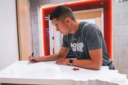 Nick Zeisloft signs Alumni Wall