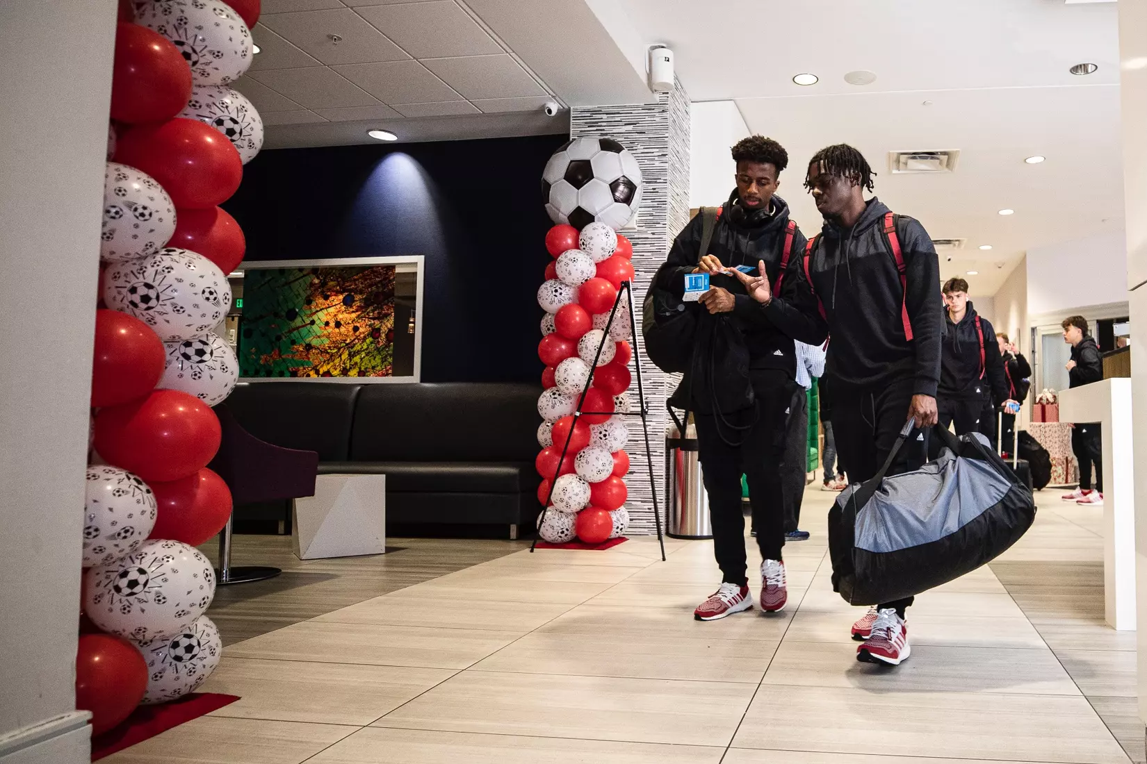 BLOOMINGTON, IN - December 07, 2022 - forward Maouloune Goumballe #14 of the Indiana Hoosiers and forward Herbert Endeley #17 of the Indiana Hoosiers arriving at the team Hotel in Cary, NC. Photo By \CXD#2\