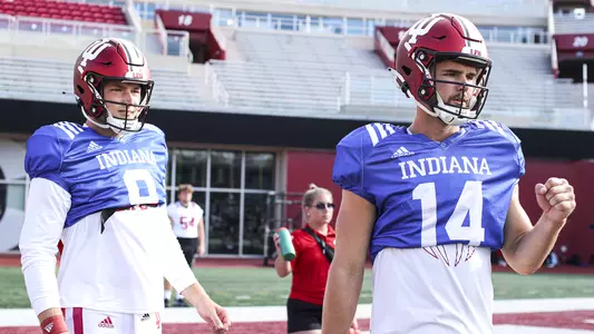 BLOOMINGTON, IN - AUGUST 12, 2022 - quarterback Connor Bazelak #9 of the Indiana Hoosiers and quarterback Jack Tuttle #14 of the Indiana Hoosiers during practice and the Indiana Hoosiers at Mellencamp Field in Bloomington, IN. Photo By Andrew Mascharka/Indiana Athletics