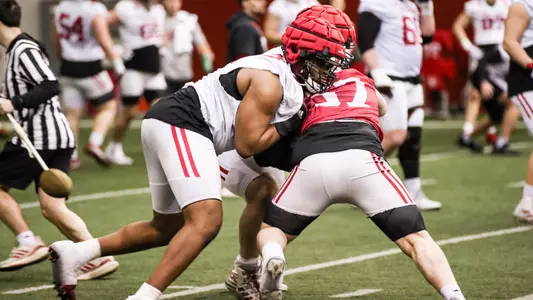 BLOOMINGTON, IN - March 07, 2023 - offensive lineman Joshua Sales Jr. #77 of the Indiana Hoosiers, defensive lineman Julian Kameristy #57 of the Indiana Hoosiers during Spring Camp at John Mellencamp Pavillion in Bloomington, IN. Photo By Rachel Gillam/Indiana Athletics