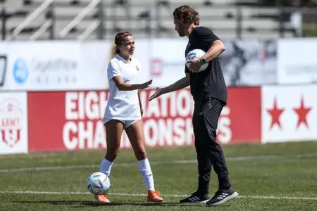 BLOOMINGTON, IN - April 15, 2023 - Head Coach Erwin Van Bennekom and midfielder Ava Akeel #27 of the Indiana Hoosiers during the game between the Illinois Fighting Illini and the Indiana Hoosiers at Bill Armstrong Stadium in Bloomington, IN. Photo By Chris Conaway/Indiana Athletics