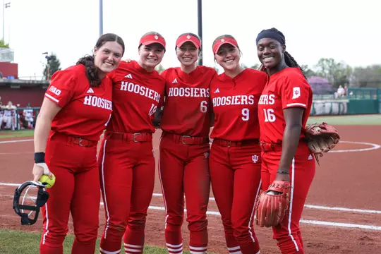 BLOOMINGTON, IN - April 15, 2023 - infield\utility player Sarah Stone #14 and catcher\utility player Avery Parker #18 and infielder Brooke Benson #6 and infielder Taryn Kern #9 and infield\pitcher Brianna Copeland #16 of the Indiana Hoosiers during the game between the Nebraska Corn Huskers and the Indiana Hoosiers at Andy Mohr Field in Bloomington, IN. Photo By Dalton Wainscott/Indiana Athletics