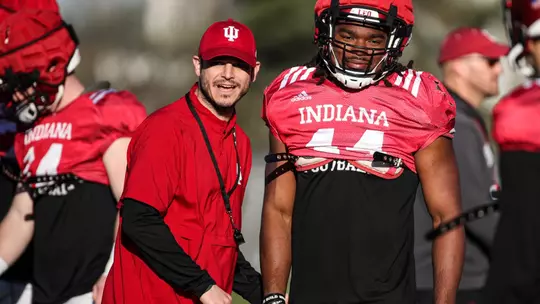 BLOOMINGTON, IN - April 13, 2023 - Indiana Hoosiers Co-Defensive Coordinator and Safeties Coach Matt Guerrieri, linebacker Aaron Casey #44 of the Indiana Hoosiers during practice at Memorial Stadium in Bloomington, IN. Photo By Rachel Gillam/Indiana Athletics