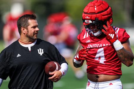 BLOOMINGTON, IN - August 03, 2023 - linebacker Anthony Jones #4 of the Indiana Hoosiers and Indiana Hoosiers Special Teams Coordinator and Outside Linebackers Coach Kasey Teegardin during Fall Camp at John Mellencamp Pavillion in Bloomington, IN. Photo By Andrew Mascharka/Indiana Athletics