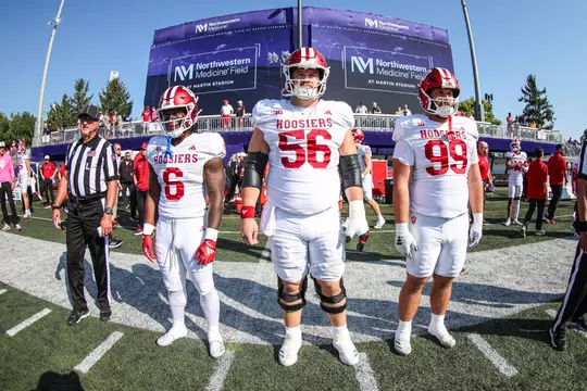 EVANSTON, Ill - October 05, 2024 - running back Justice Ellison #6 of the Indiana Hoosiers, offensive lineman Mike Katic #56 of the Indiana Hoosiers, and defensive lineman James Carpenter #99 of the Indiana Hoosiers during the game between the Indiana Hoosiers and the Northwestern Wildcats at Northwestern Medicine Field at Martin Stadium in Evanston, Illinois. Photo By Trent Barnhart/Indiana Athletics