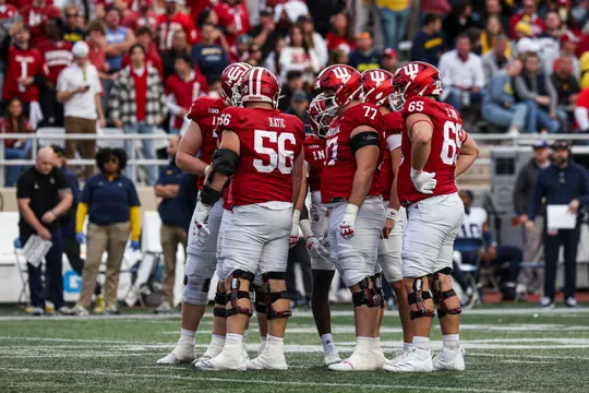 BLOOMINGTON, IN - November 9, 2024 - offensive lineman Mike Katic #56 of the Indiana Hoosiers, offensive lineman Tyler Stephens #77 of the Indiana Hoosiers and offensive lineman Carter Smith #65 of the Indiana Hoosiers during the game between the Michigan Wolverines and the Indiana Hoosiers at Memorial Stadium in Bloomington, Indiana. Photo By Dani Meersman/Indiana Athletics