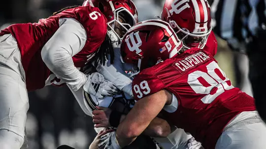 BLOOMINGTON, IN - November 30, 2024 - defensive lineman Mikail Kamara #6 of the Indiana Hoosiers and defensive lineman James Carpenter #99 of the Indiana Hoosiers during the game between the Purdue Boilermakers and the Indiana Hoosiers at Memorial Stadium in Bloomington, Indiana. Photo By Trent Barnhart/Indiana Athletics