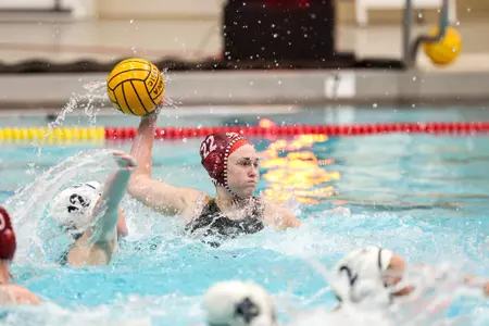 BLOOMINGTON, IN - February 17, 2024 - attacker Savannah Batchelor #22 of the Indiana Hoosiers during the meet between the California Baptist Lancers and the Indiana Hoosiers at Counsilman-Billingsley Aquatics Center in Bloomington, IN. Photo By Andrew Mascharka/Indiana Athletics