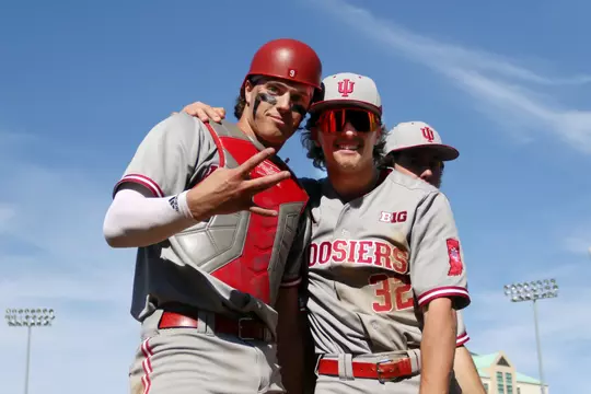 FRISCOE, TEXAS - March 2, 2024 - catcher Brock Tibbitts #9 of the Indiana Hoosiers and infielder/outfielder Josh Pyne #32 of the Indiana Hoosiers during the game between the Dallas Baptist Patriots and the Indiana Hoosiers at Riders Field in Friscoe, Texas. Photo By Paige Grider