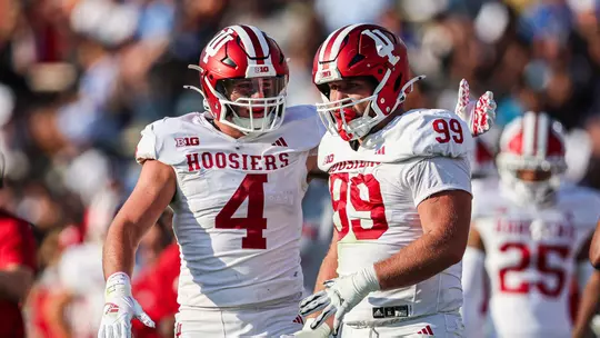 PASADENA, CA - September 14, 2024 - line backer Aiden Fisher #4 of the Indiana Hoosiers and defensive lineman James Carpenter #99 of the Indiana Hoosiers during the game between the UCLA Bruins and the Indiana Hoosiers at the Rose Bowl Stadium in Pasadena, California. Photo By Trent Barnhart/Indiana Athletics