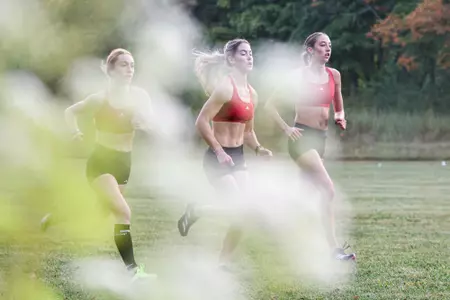BLOOMINGTON, IN - September 18, 2025 - Joey Rastrelli of the Indiana Hoosiers; Katelyn Winton of the Indiana Hoosiers; Ava Jarrell of the Indiana Hoosiers during practice at IU Championship Cross County Course in Bloomington, IN. Photo By Spencer Meyer/Indiana Athletics