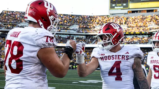 IOWA CITY, IA - September 27, 2025 - offensive lineman Patrick "Pat" Coogan #78 of the Indiana Hoosiers and linebacker Aiden Fisher #4 of the Indiana Hoosiers during the game between the Iowa Hawkeyes and the Indiana Hoosiers at Kinnick Stadium in Iowa City, IA. Photo By Dani Meersman/Indiana Athletics