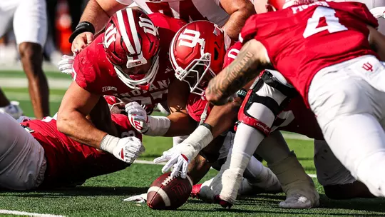 BLOOMINGTON, IN - November 15, 2025 - linebacker Aiden Fisher #4 of the Indiana Hoosiers, defensive lineman Hosea Wheeler #0 of the Indiana Hoosiers, and defensive lineman Mario Landino #97 of the Indiana Hoosiers during the game between the Wisconsin Badgers and the Indiana Hoosiers at Merchants Bank Field at Memorial Stadium in Bloomington, IN. Photo By Kate Petersen/Indiana Athletics