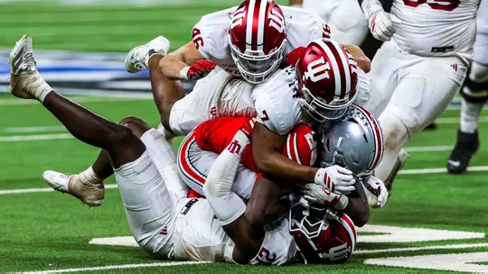 INDIANAPOLIS, IN - December 06, 2025 - linebacker Rolijah Hardy #21 of the Indiana Hoosiers and defensive back Louis Moore #7 of the Indiana Hoosiers and linebacker Isaiah Jones #46 of the Indiana Hoosiers during the game between the Ohio State Buckeyes and the Indiana Hoosiers at Lucas Oil Stadium in Indianapolis, IN. Photo By Luke Miller/Indiana Athletics