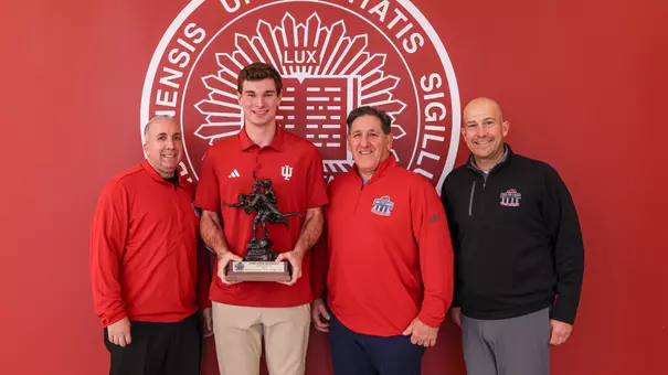 BLOOMINGTON, IN - December 10, 2025 - quarterback Fernando Mendoza #15 of the Indiana Hoosiers and staff of Walter Camp Foundation during the Walter Camp Player of the Year Presentation at Memorial Stadium in Bloomington, IN. Photo By Dani Meersman/Indiana Athletics