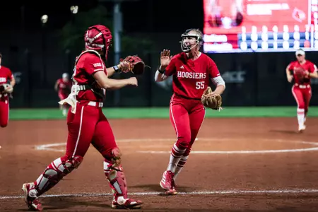 BLOOMINGTON, IN - April 15, 2026 - catcher\utility Avery Parker #18 of the Indiana Hoosiers and pitcher Taylor Hess #55 of the Indiana Hoosiers during the game between the Louisville Cardinals and the Indiana Hoosiers at Don Dobina Field at Ulmer Stadium. Photo By Emma Pearce/Indiana Athletics