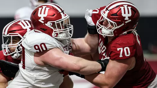BLOOMINGTON, IN - April 07, 2026 - defensive lineman Joe Hjelle #90 of the Indiana Hoosiers and offensive lineman Austin Leibfried #70 of the Indiana Hoosiers during practice at Mellencamp Pavilion in Bloomington, IN. Photo By Dani Meersman/Indiana Athletics