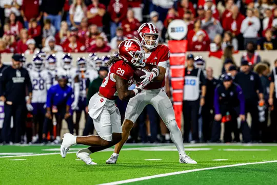 BLOOMINGTON, IN - September 25, 2026 - Lee Beebe Jr. #29 of the Indiana Hoosiers and quaterback Josh Hoover #9 of the Indiana Hoosiers during the game between the Northwestern Wildcats and the Indiana Hoosiers at Merchants Bank Field at Memorial Stadium in Bloomington, IN. Photo By Indiana Athletics
