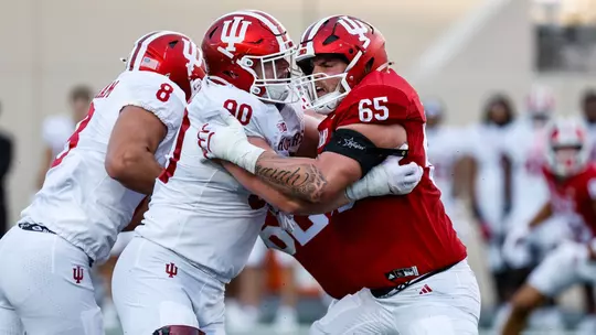 BLOOMINGTON, IN - August 25, 2026 - defensive lineman Joe Hjelle #90 of the Indiana Hoosiers and offensive lineman Carter Smith #65 of the Indiana Hoosiers during practice at Merchants Bank Field at Memorial Stadium in Bloomington, IN. Photo By Dani Meersman/Indiana Athletics