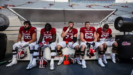 BLOOMINGTON, IN - August 25, 2026 - offensive lineman Joe Brunner #56 of the Indiana Hoosiers and offensive lineman Adedamola Ajani #72 of the Indiana Hoosiers and offensive lineman Bray Lynch #74 of the Indiana Hoosiers and offensive lineman Drew Evans #62 of the Indiana Hoosiers and offensive lineman Carter Smith #65 of the Indiana Hoosiers during practice at Merchants Bank Field at Memorial Stadium in Bloomington, IN. Photo By Luke Miller/Indiana Athletics