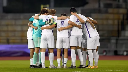 Men's soccer huddle