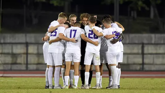 Men's soccer huddle vs. Ga St