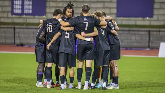 Men's soccer huddle