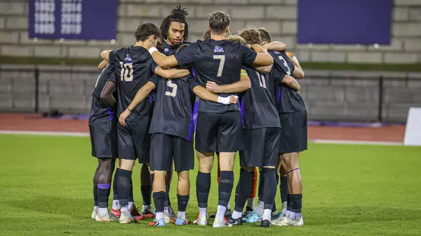 Men's soccer huddle
