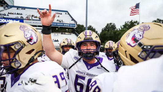 Zach Greenberg raising his hand in the air during pregame warmups at Old Dominion.