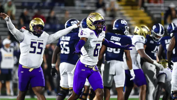 DJ Kelly and the defense celebrate a stop against Georgia Southern.