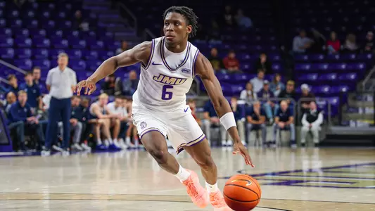 Ace Meeks drives towards the basket during JMU's exhibition against Richmond