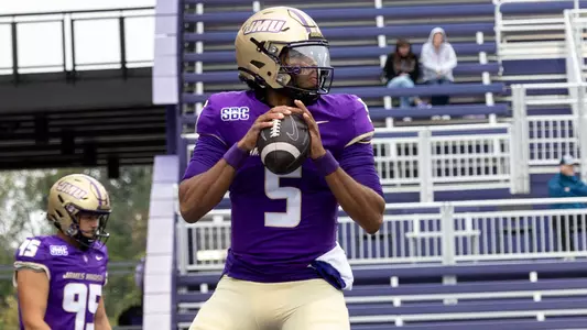 Arrington Maiden warms up ahead of JMU's game against Marshall