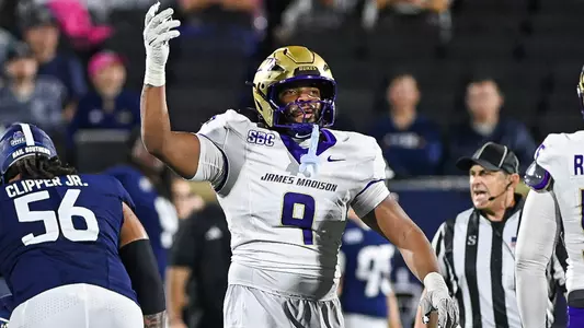 Kei'Trone Simpson celebrates after making a stop against ODU