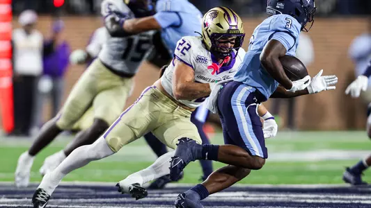 Chase Regan tackles the ball carrier against ODU