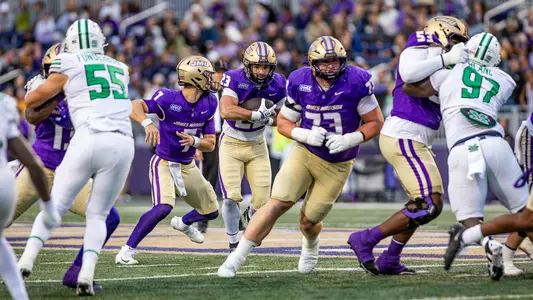 Nick Herman receives handoff after fake from Coleman with Bushong leading the way.