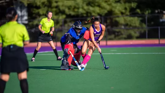 Mika Hilburger moving around Massachusetts goalkeeper during penalty shootout at the JMU Field Hockey Complex