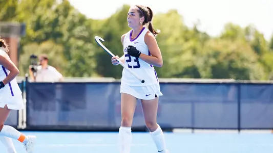 Callen Todd jogging off field against Liberty at the Liberty Field Hockey Field
