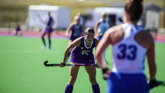 Sydney Raguini squared up playing defense against a Duke player at the JMU Field Hockey Complex