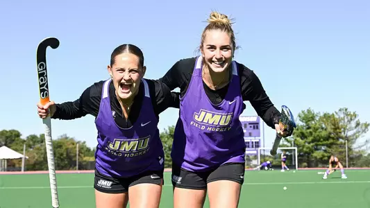 Skyler Brown and Maddie Tierney posing with arms around each other at practice
