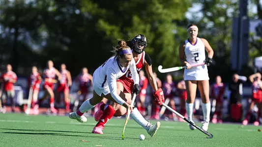 Skyler Brown takes a diving shot on goal against Miami (Ohio) at the JMU Field Hockey Complex