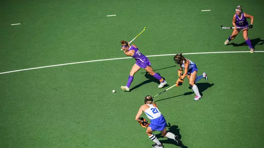 Skyler Brown winds up for a shot versus Duke during a penalty corner at the JMU Field Hockey Complex