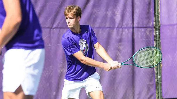 Esteve Agusti prepares for a forehand shot at a JMU home match.