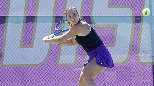 Sophie Williams prepares to hit a backhand shot in JMU's victory against East Carolina.