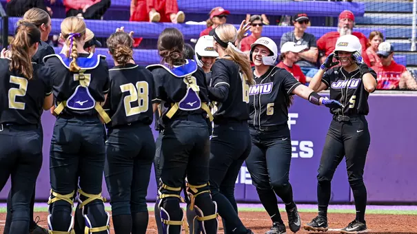 James Madison softball celebrates home run victories as a team
