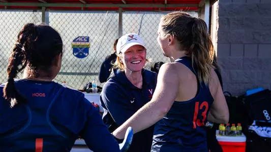 Alyssa Parker speaking with Virginia field hockey players