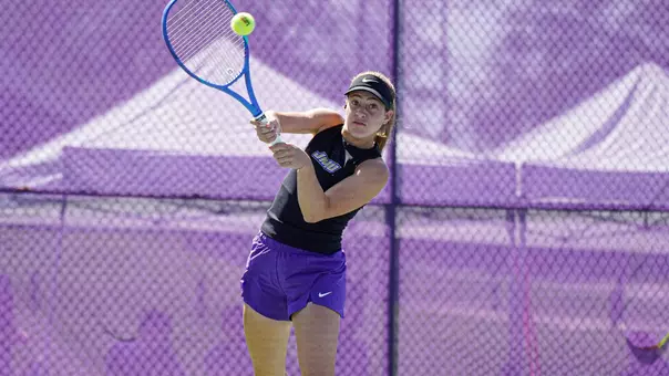 Ariel Avidan hits a backhand shot in a home match versus East Carolina.