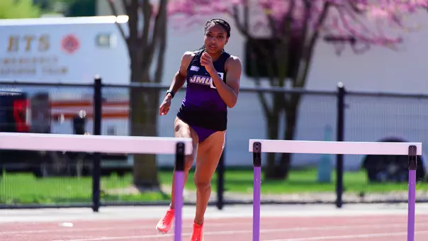 Sky Bleu Tyson coming up to a hurdle in the 400-meter hurdles race at Sentara Park.