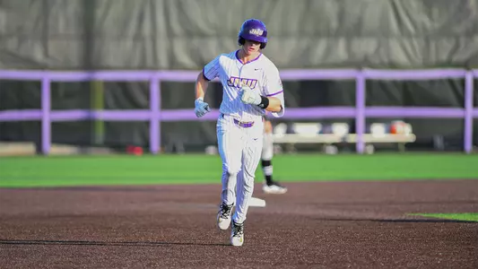 Clay Thompson jogging around the bases after hitting a home run against Louisiana at Veterans Memorial Park